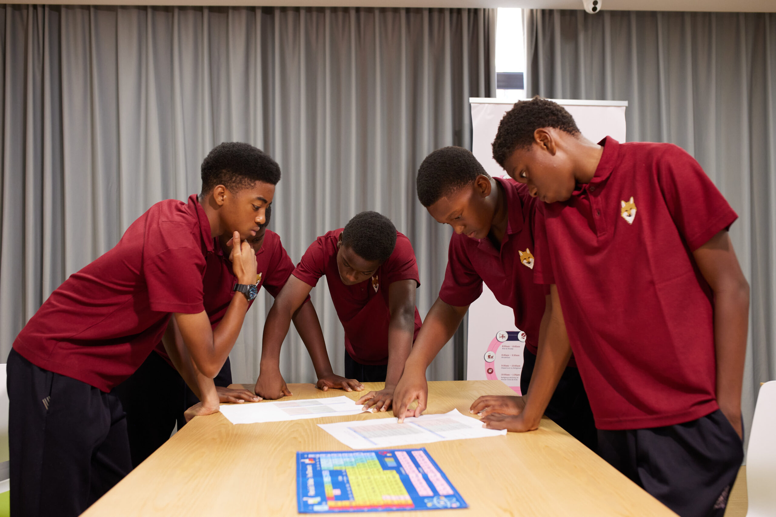Charterhouse Lagos students collaborating around a classroom table