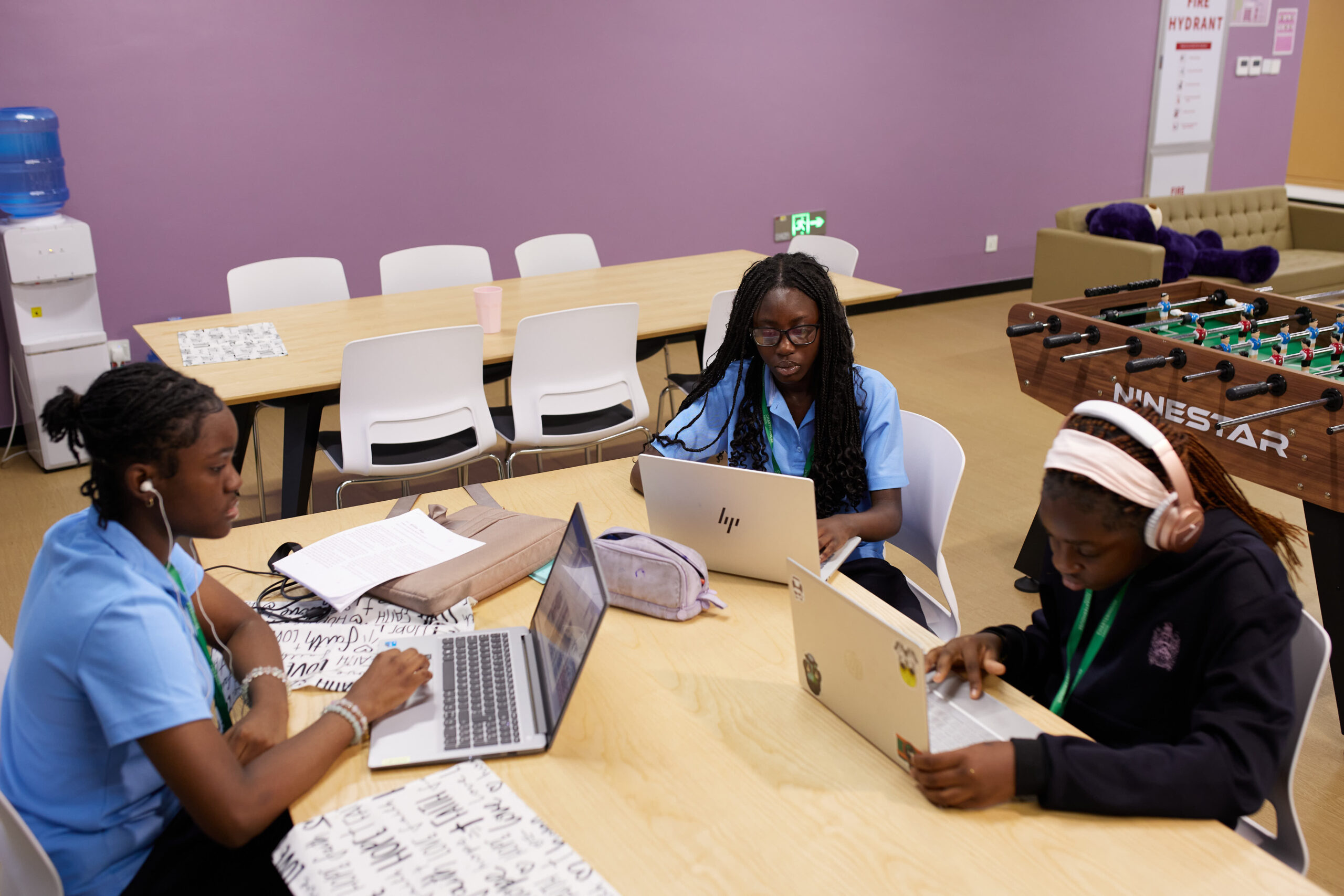 Charterhouse Lagos students studying together with laptops
